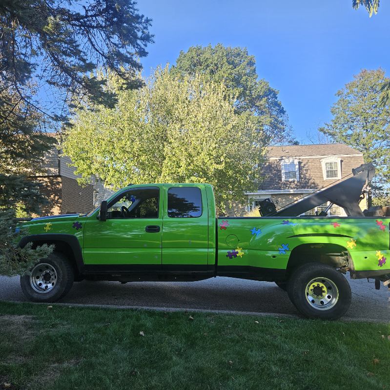 Junk car being hauled away by B-Line Towing truck